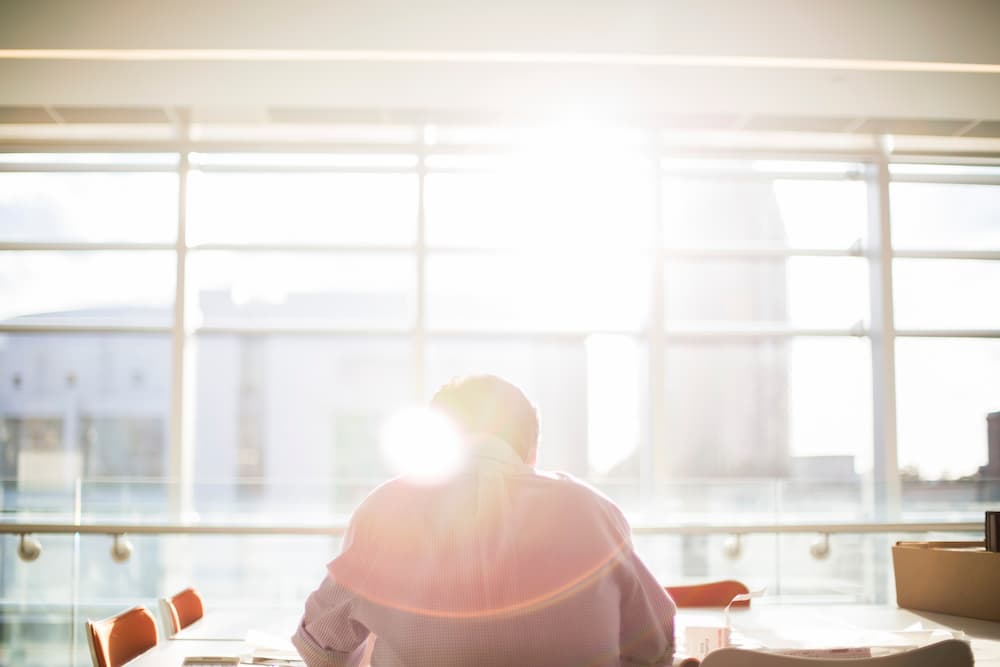 Business man sunny window